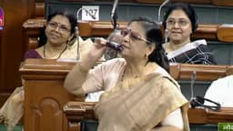 কাঁচা বেগুনে কামড় বসিয়ে মূল্যবৃদ্ধির প্রতিবাদ