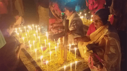 পাঁচবিবিতে মোমবাতি প্রজ্বলন করে মৃত স্বজনদের আত্মার শান্তি কামনা